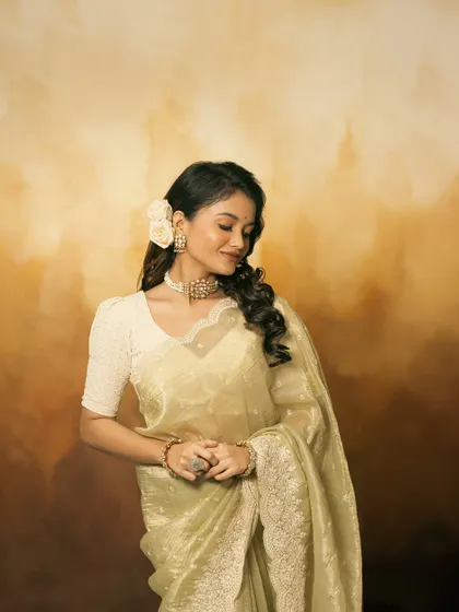 This shot captures a moment of quiet elegance, with the jewellery adding a subtle sparkle.