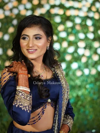 A candid, happy moment. The makeup is designed to look just as good in candid shots as it does in posed portraits, capturing your natural joy.