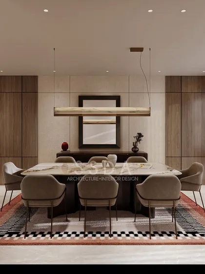 Simplicity and elegance define this dining room concept for a Delhi villa. The space features clean lines, a neutral color palette, and a striking patterned rug that anchors the room without overwhelming it.