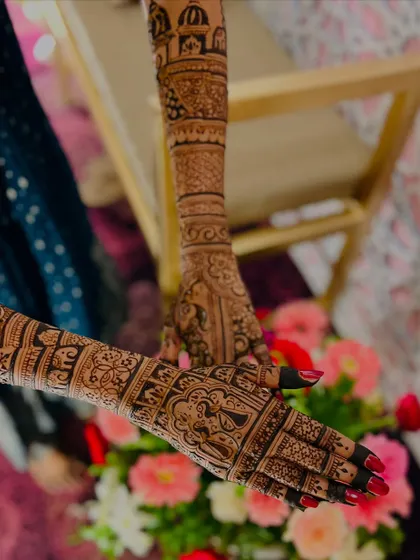 Another angle of a detailed bridal design, showing how the patterns wrap around the arm for a complete 360-degree look.