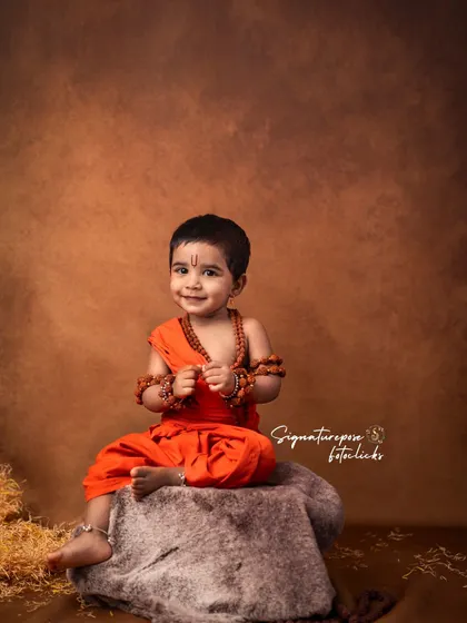 A happy and relaxed moment during the Rama-themed shoot. This candid smile shows the enjoyable experience children have during these elaborate and creative sessions.