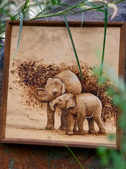A pyrography piece showing a tender moment between two elephants. This wood burn art not only celebrates the beauty of wildlife but also raises awareness about conservation.