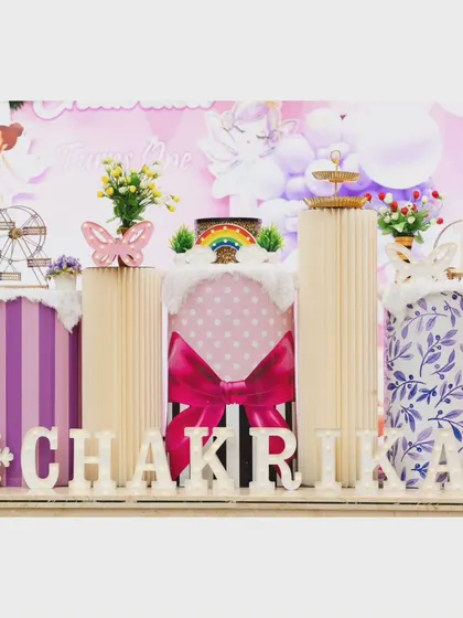 A close-up of the custom pedestals and 'CHAKRIKA' light-up letters.