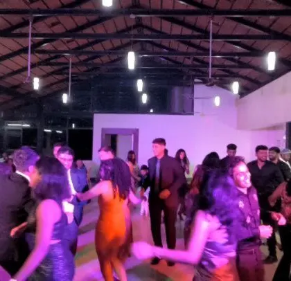 The dance floor is active at this fun-filled Catholic wedding reception.
