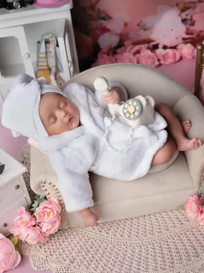 Our little diva girl. Relaxing on her mini sofa after a busy day of being adorable, complete with a phone for all her important calls.