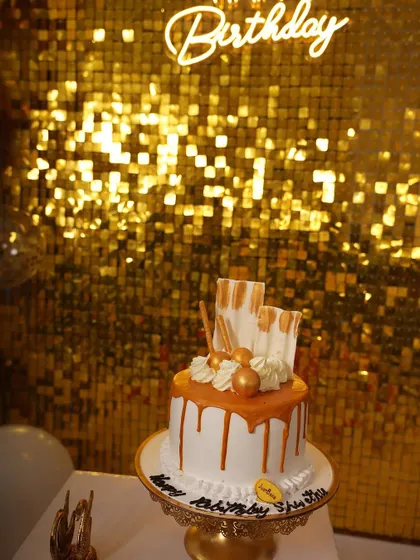 A close-up shot of the birthday cake against the gold shimmer backdrop. My setups are designed to look great from every angle, making them perfect for detailed photos of cakes, gifts, or products.