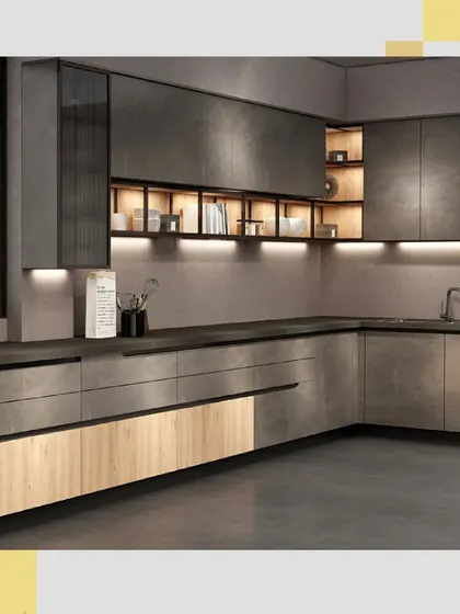 The interplay of light and shadow on the textured grey cabinets and open shelving creates a moody and sophisticated atmosphere in this L-shaped kitchen.