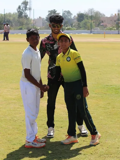 A moment of sportsmanship as players from opposing teams shake hands after a match.