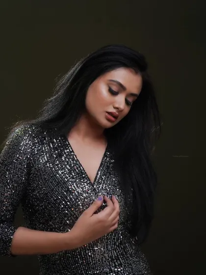 A contemplative pose for a fashion shoot. This image shows a different side of the model, adding range and depth to her professional portfolio.