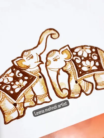 A pair of decorated elephants, perfect for a bridal design. In my classes, we learn how to draw these royal figures and adorn them with intricate patterns.