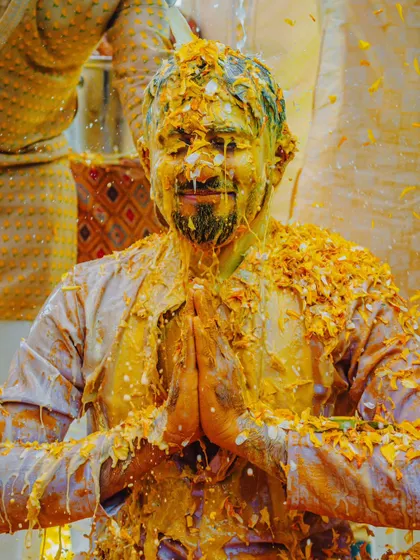 A moment of peace and prayer amidst the Haldi chaos. This shot of the groom captures a different, more serene side of the ceremony.