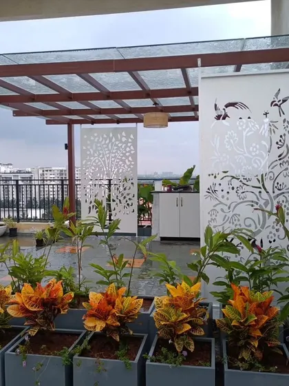 A closer look at the custom laser-cut panels used in the Adarsh Palm Retreat project. These screens add an artistic touch while separating the space and providing partial shade.
