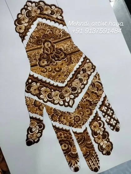 This is a practice sheet of a full-coverage bridal design. We work on paper like this to perfect the layout, flow, and combination of different fillers like floral bands and cross-hatching before applying to skin.