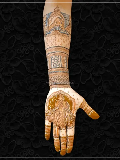 A stunning bridal design featuring a bride figure on the palm and a doli scene on the arm. The use of negative space makes the figures stand out beautifully.