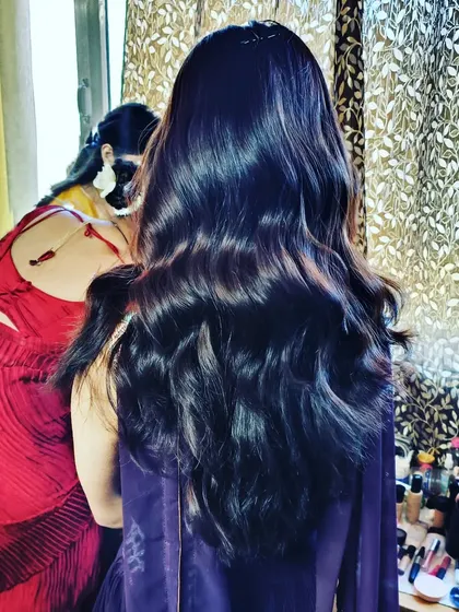A behind-the-scenes shot of creating soft, flowing waves that look effortlessly beautiful and natural.