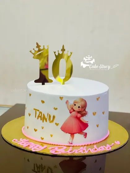 A simple and sweet cake for Tanu's 10th birthday. This design features a cute girl illustration, golden hearts, and shiny gold number toppers to celebrate the big double digits.
