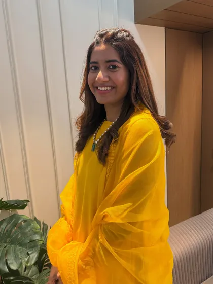 The final look! A simple and pretty hairdo for a Haldi guest. The soft curls and front braid are perfect for a daytime event.