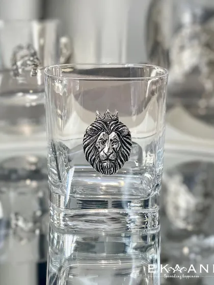 A whiskey glass for the king of the castle. This glass features a bold, silver-plated lion head emblem, crowned and majestic. It is a statement piece for any home bar.