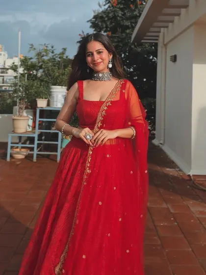 Another portrait of the client, looking radiant in her custom outfit.