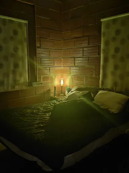 This is one of the bedrooms where the dogs are welcome to sleep. I provide a calm, dimly lit environment at night to ensure all my guests get a restful sleep.