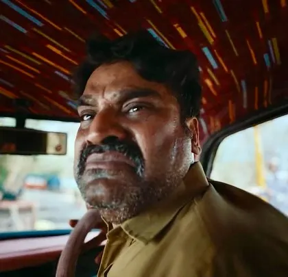 A great character shot of the taxi driver from the Bullet Echo ad. His expression and simple costume design are key to the scene's comedy.