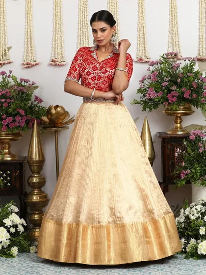 The full look of the beige lehenga with the collared blouse, exuding confidence and modern style.