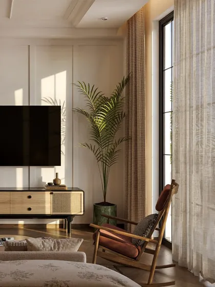 The TV console, also with cane detailing, sits opposite the bed. The design maintains a cohesive, classic aesthetic throughout the room.