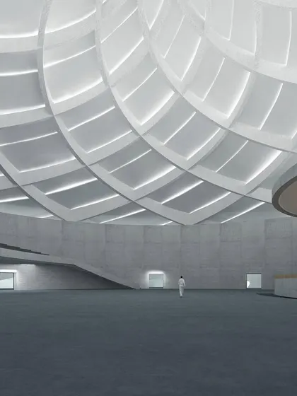A serene design to embrace the orisons. This conceptual render shows a large, open prayer hall with a magnificent coffered dome ceiling that filters light, creating a tranquil and spiritual atmosphere.