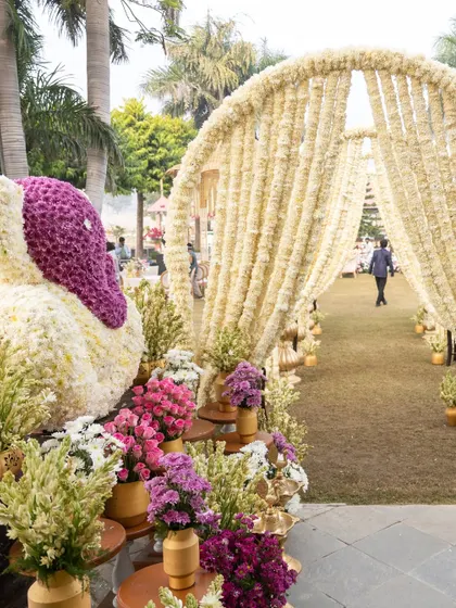 A beautiful floral Ganesha and a walkway of flowers leading to the wedding mandap. I believe in creating divine entrances for the most sacred part of the celebration.