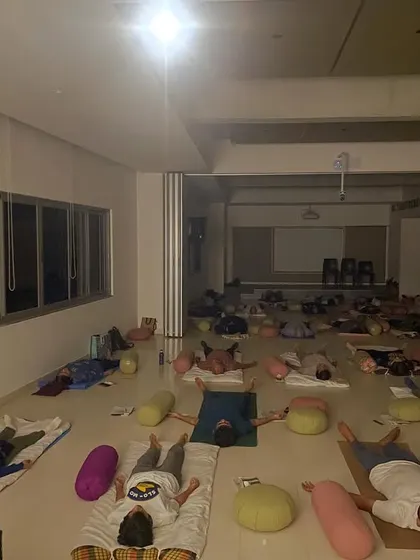 Another angle of the deep relaxation session at the Bangalore International Centre. It shows how a large group can share a space of silence and stillness, disconnecting from their digital lives together.
