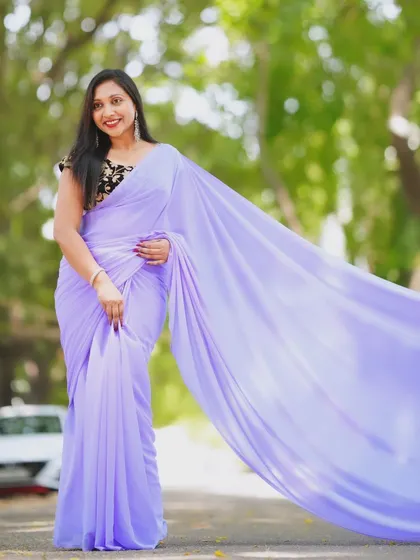 A smiling portrait in the lavender trail saree, perfect for capturing a happy moment.