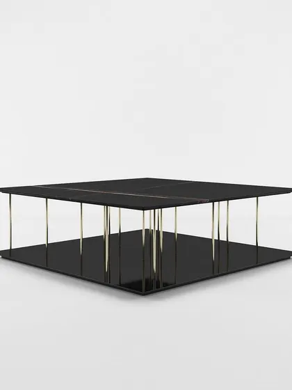 A studio view of our modern two-tier center table, highlighting its minimalist design and the striking contrast between the black surfaces and metallic supports.
