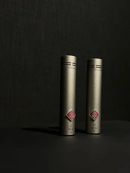 The Neumann KM184 is a small-diaphragm condenser microphone renowned for its clarity and detail, making it a perfect choice for recording acoustic instruments like guitar and piano.