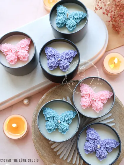 The 'Mariposa' butterfly candles in cool tones of blue, purple, and pink. These are a beautiful and whimsical addition to my spring collection.
