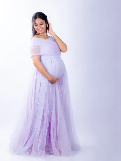 Another beautiful shot of our Breezy gown. The off-shoulder neckline and flowing tulle are incredibly flattering and comfortable.
