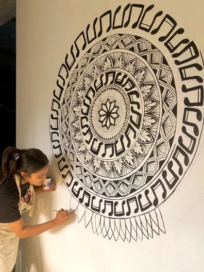 I meant it when I said I drew this mural freehand. Here I am working on a music themed mandala without any stencils or projections, just a brush and a vision.