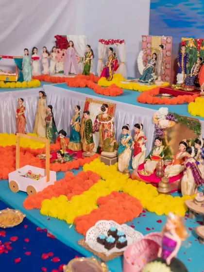 A wide view of Sheetal's baby shower rukhwat, filled with vibrant colors, flowers, and numerous doll scenes that tell a story.