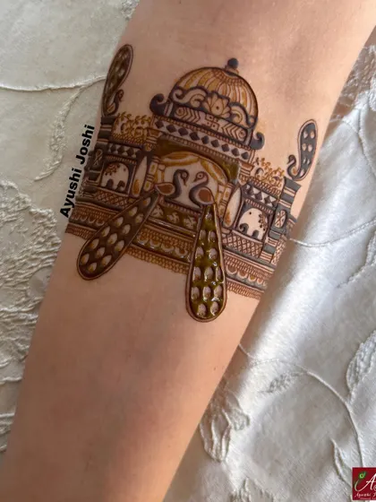 A beautiful arm band design with peacocks, swans, and elephants, perfect for a royal bridal look.