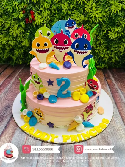 A two-tier Baby Shark cake for a "Daddy's Princess". This design is perfect for a second birthday, with bright colours and all the favourite characters.