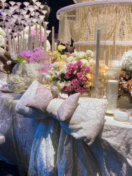 A detail of the custom-made lace bow adorning the table, a nod to the 'Lace Love' theme. This bespoke element demonstrates our commitment to craftsmanship and thematic consistency.