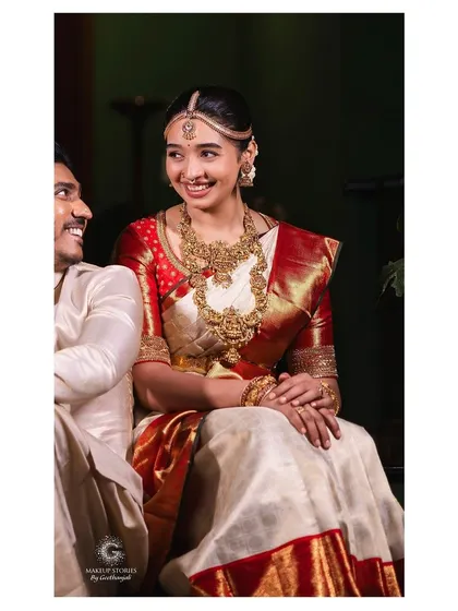 A happy, candid moment between the bride and groom. Priyanka's natural look ensures that the joy and love between the couple are the true focus of this beautiful photograph.