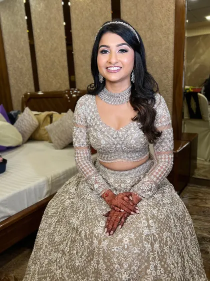 A seated portrait of the bride, looking like a modern princess.