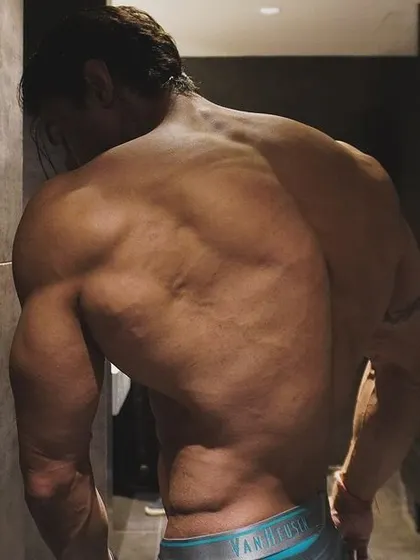 A side shot of my back, a reminder of the relentless work that goes on behind the scenes.