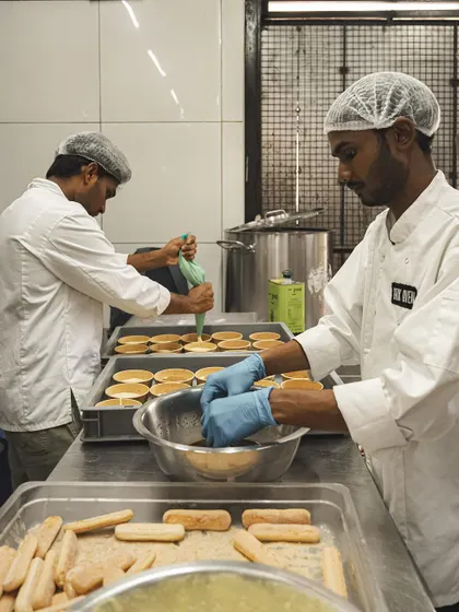 Behind the scenes with our dessert team. Here they are, carefully assembling our Tiramisu and Banoffee Pie desserts in our central kitchen.