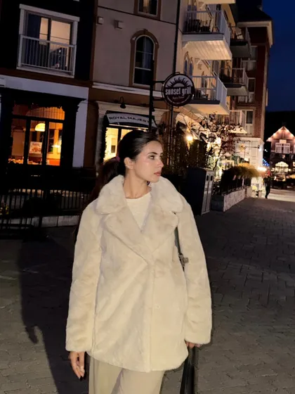 Looking back at the charming, lit-up streets of Blue Mountain village at night.