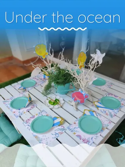 The activity table for the 'Under the Sea' party, where kids could paint shells and corals.