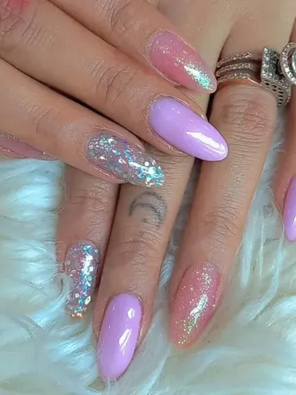 A lovely pastel set combining solid lavender with pink and silver glitter accent nails.