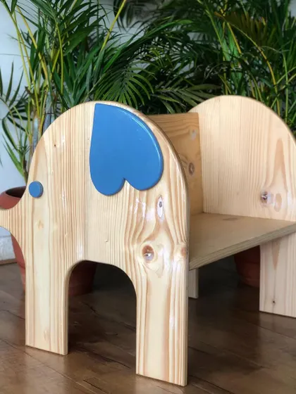 The elephant chair is designed to be both a seat and a friend. The solid wood construction ensures it's tough enough for years of play.