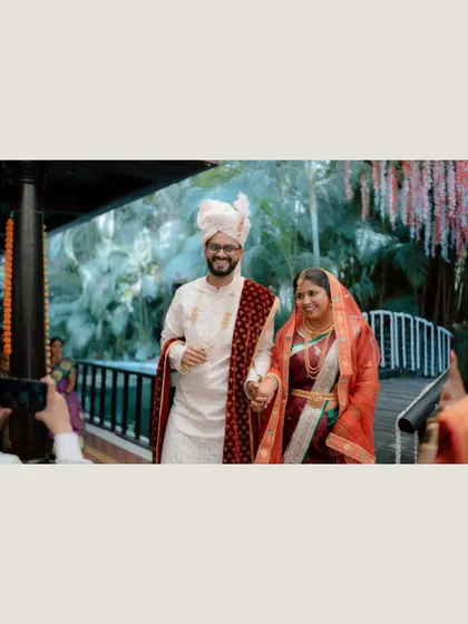 The bride and groom's grand entrance together over a bridge at the wedding venue. It’s a beautiful, cinematic start to their ceremony.