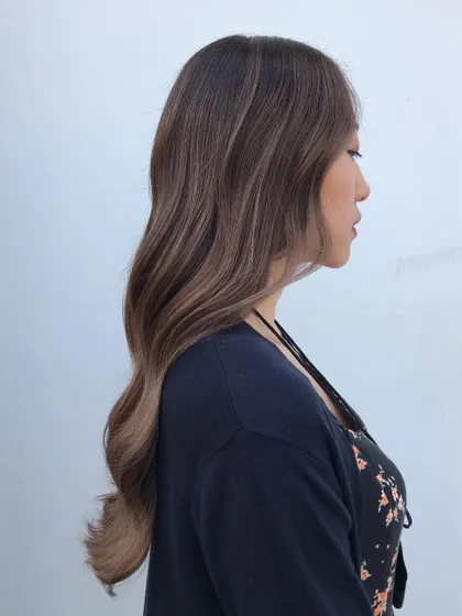A side profile of the French balayage, highlighting the subtle and sophisticated dimension it adds to the hair.